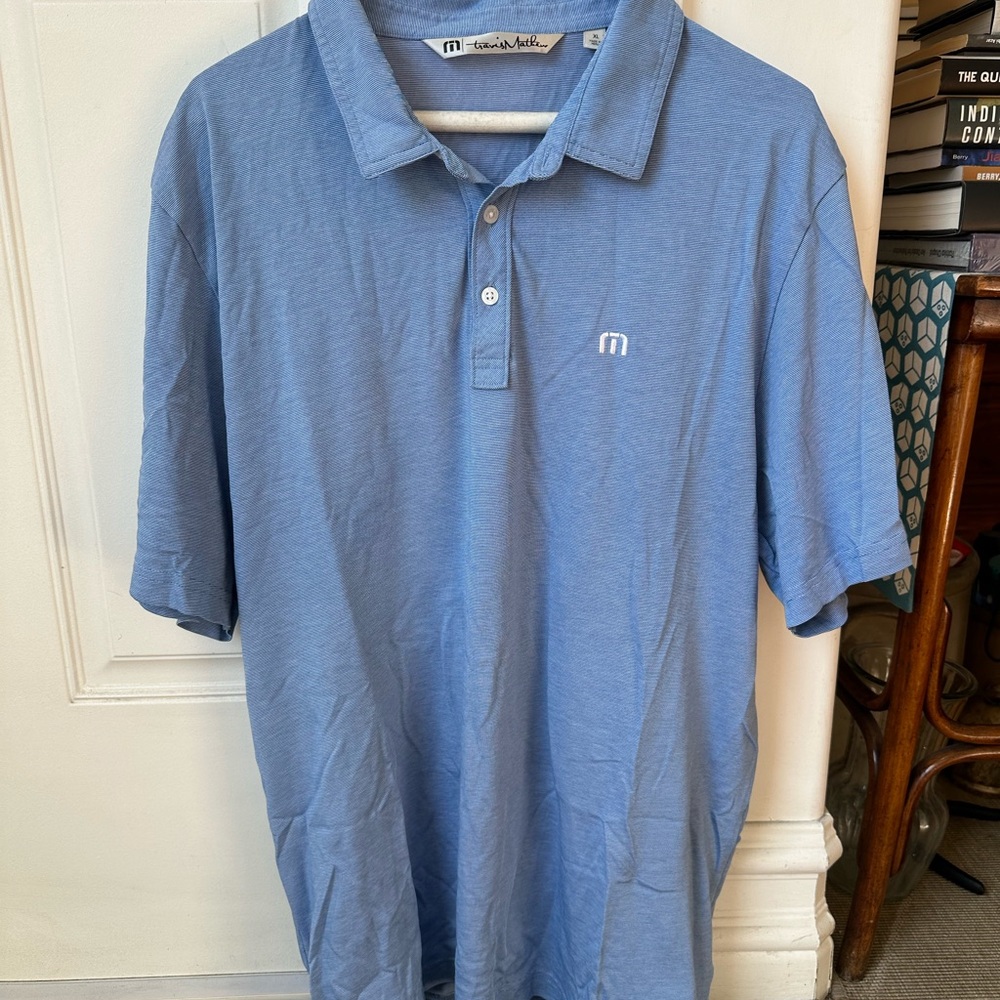 Travis Mathew Men's Sky Blue Polo Shirt with Subtle Logo